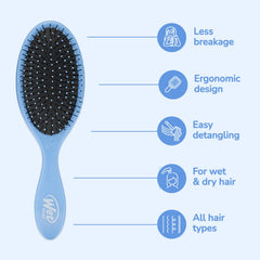 Wet Brush held in hand to show scale and comfortable control during brushing