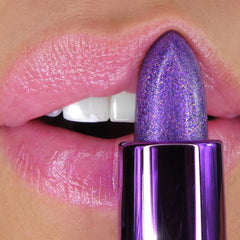 Winky Lux Amethyst Glimmer Balm on lips delivers soft, shimmering pout.