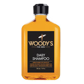 Woody's Men's Daily Shampoo bottle on shelf delivering nourishing Vitamin B5 and Aloe hydration.