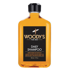 Woody's Men's Daily Shampoo bottle on shelf delivering nourishing Vitamin B5 and Aloe hydration.