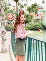 WOVOWOVO mouse ears worn in portrait with vibrant red bow sparkles