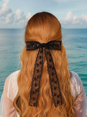 XFYUZR tassel bow clip black pairs with formal and casual looks.