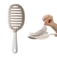 Xinqirity self-cleaning hair brush front view enables quick cleanup after styling.