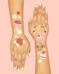 xo-fetti strawberry tattoos foil-cake designs shine on dessert tables.