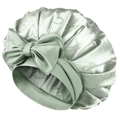 YANIBEST adjustable satin bonnet green on bed for overnight hair care