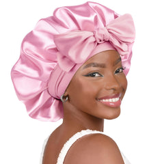 YANIBEST silk bonnet close-up shows buttery-satin texture for gentle hair protection at night.