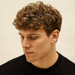 YEALIR curl cream on wet hair demonstrates easy application for defined waves.