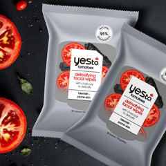 Yes To Tomatoes wipes on-the-go with phone and keys indicating travel-friendly use