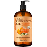 Yoken cold-pressed pumpkin seed oil in amber bottle shows purity for skin and hair care.