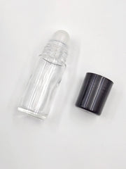 YYNGJCK clear glass roller bottle detail emphasizing corrosion resistance and purity.