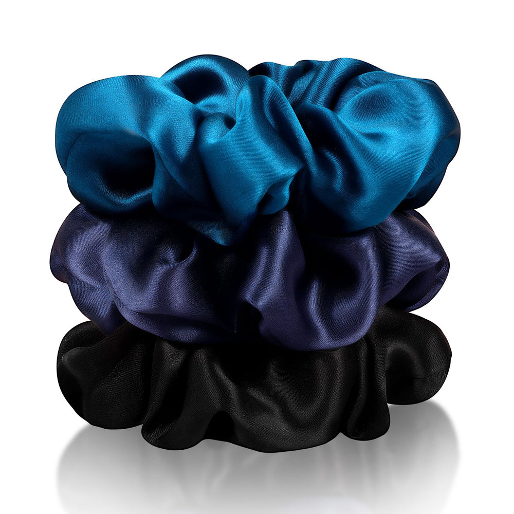 Zenssia silk scrunchies in black hold a smooth ponytail with reduced friction.
