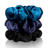 Zenssia silk scrunchies in black hold a smooth ponytail with reduced friction.