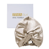 ZIMASILK 22 Momme silk bonnet on bed reduces friction for smooth mornings.
