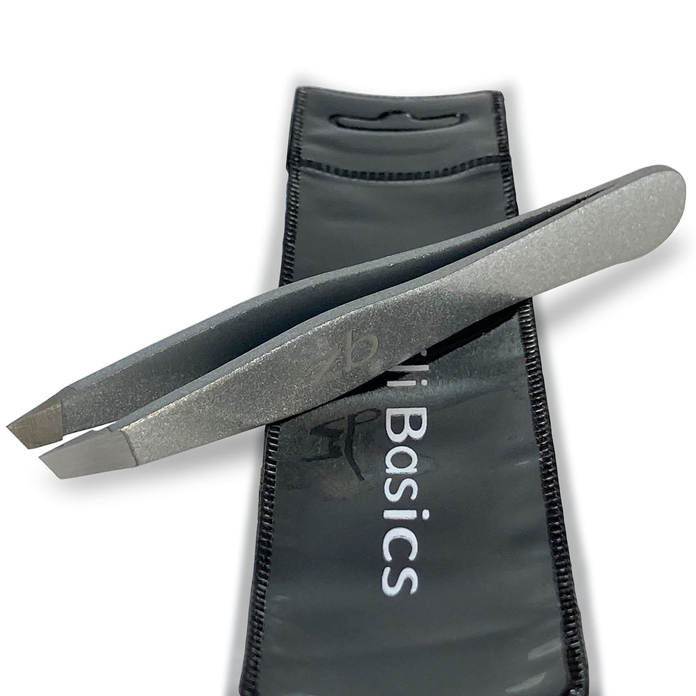 Zizzili Basics tweezers close-up shows surgical-grade stainless steel for precise hair removal