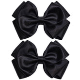 Zolyco 4.5-inch black satin bow clip close-up showing premium texture for girls.