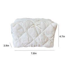 ZUNUONUO cotton quilted makeup bag open shows space for cosmetics and skincare essentials.