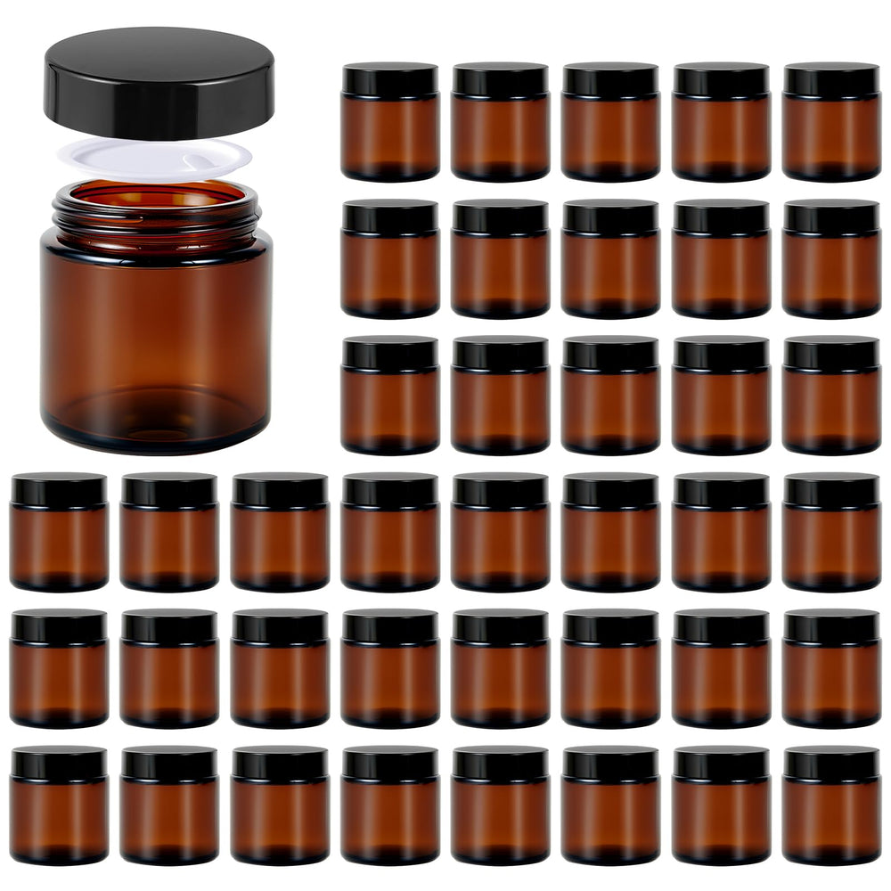 11 Hoa Kinh amber glass jar 4oz with black lid front view, compact and protective