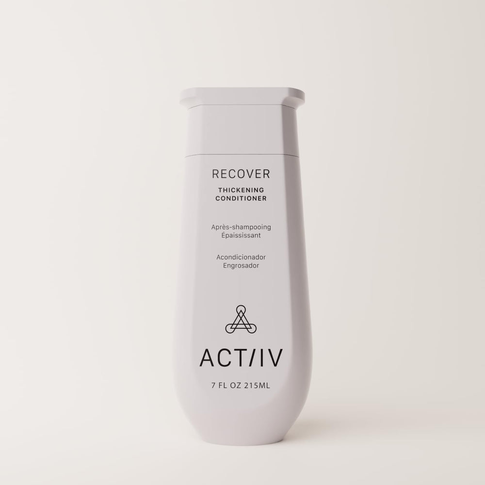 ACTIIV Recover conditioner application on hands shows easy, even distribution for hydrated strands
