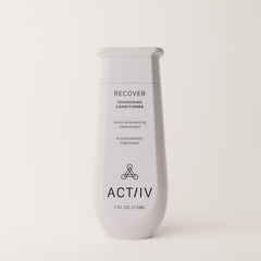 ACTIIV Recover conditioner application on hands shows easy, even distribution for hydrated strands