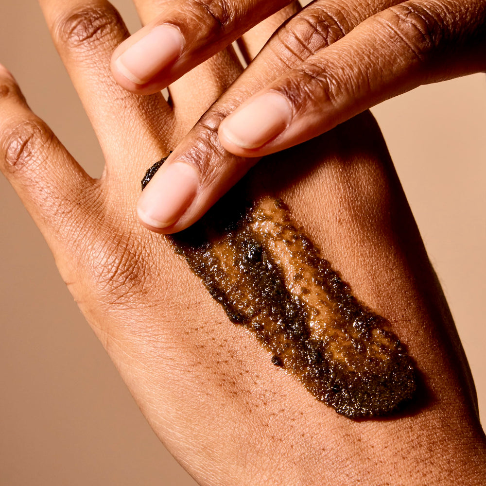 Acure Brightening Body Scrub Niacinamide detail emphasizes skin clarity.