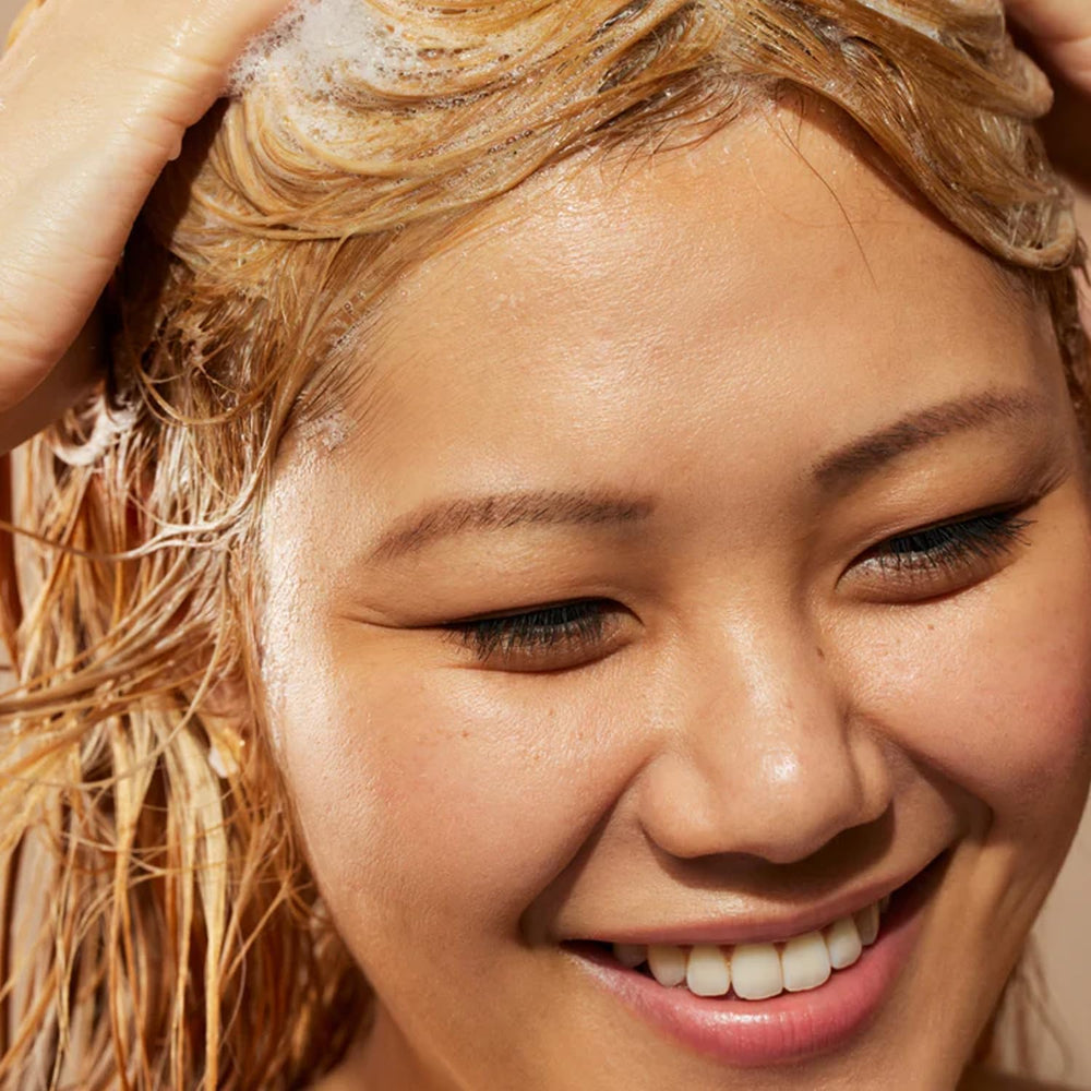 Acure Coconut water splash highlights lightweight hydration without weighing hair down.