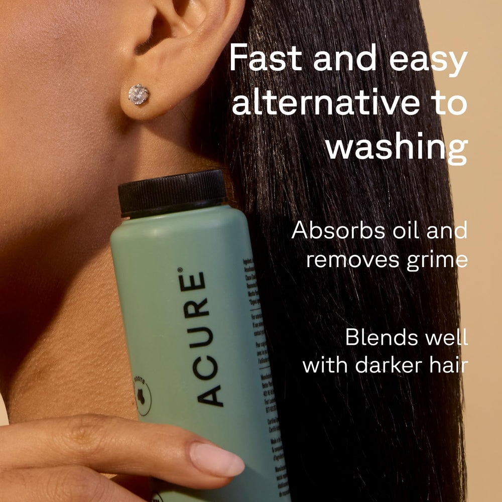 Acure dry shampoo powder application close-up shows oil absorption.