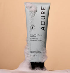 Acure Marula oil drops illustrate frizz-taming shine and healthy-looking hair.