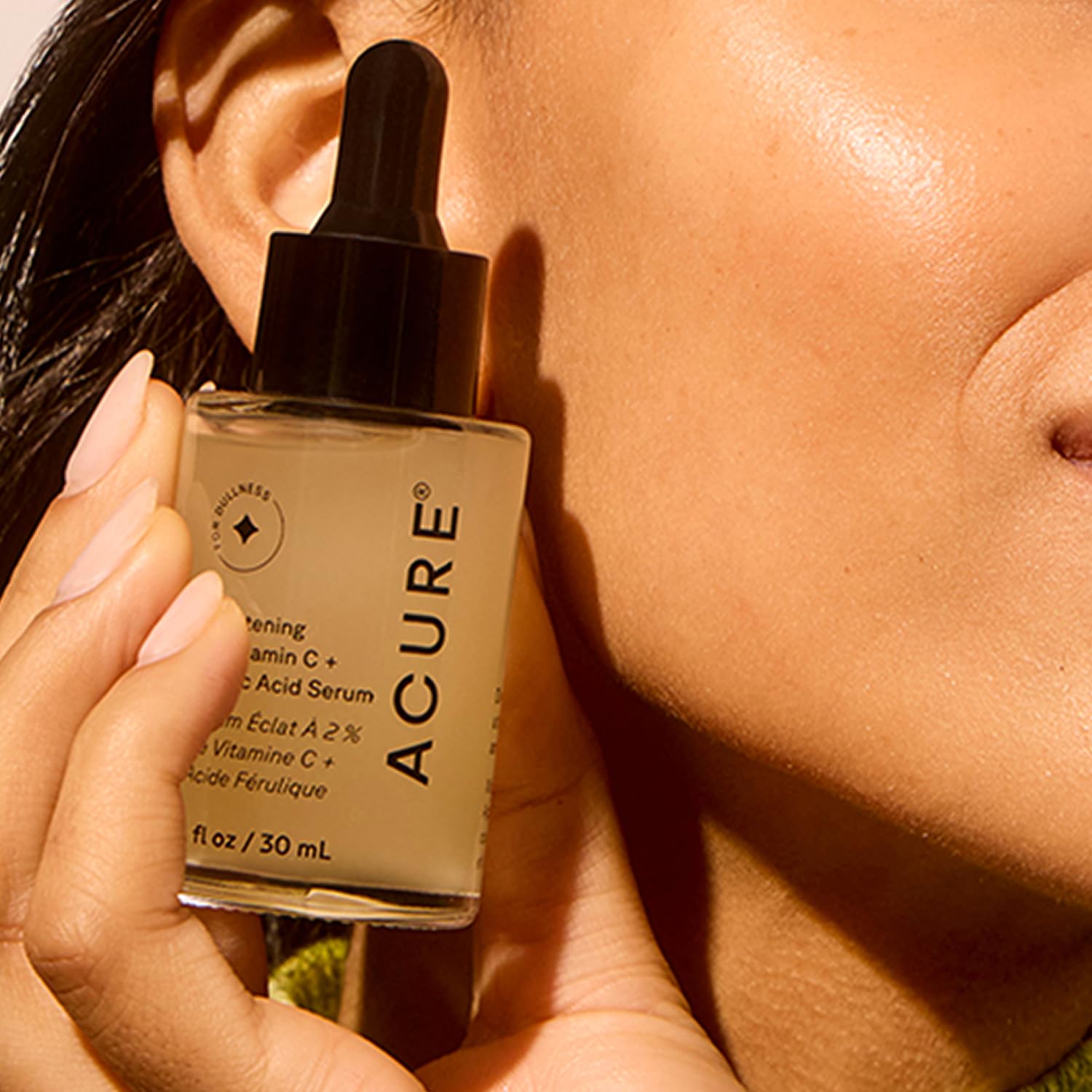 Acure serum texture on skin demonstrates lightweight hydration and absorption