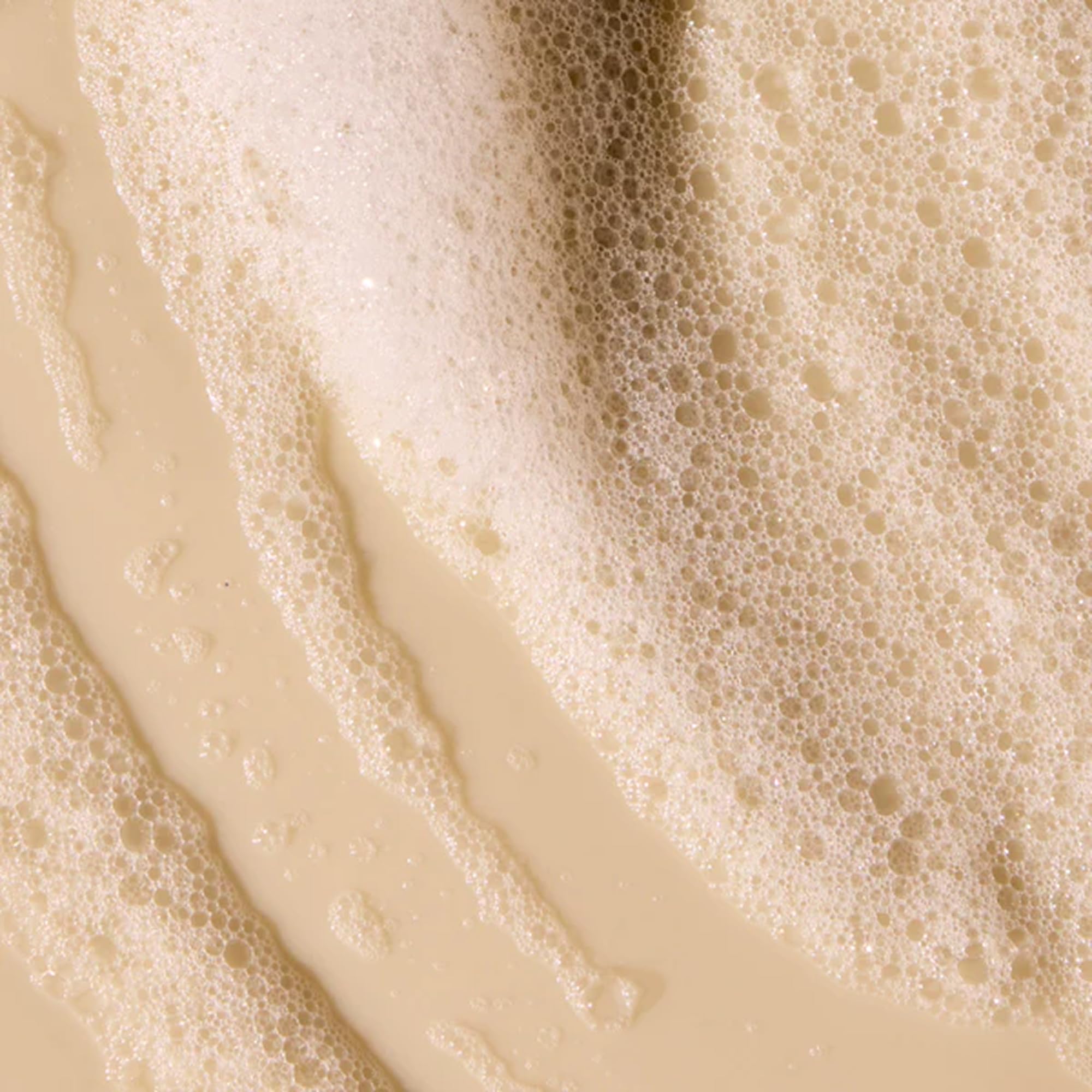 Acure Simply Smoothing Shampoo marula oil detail highlights shine boost and smoother texture.