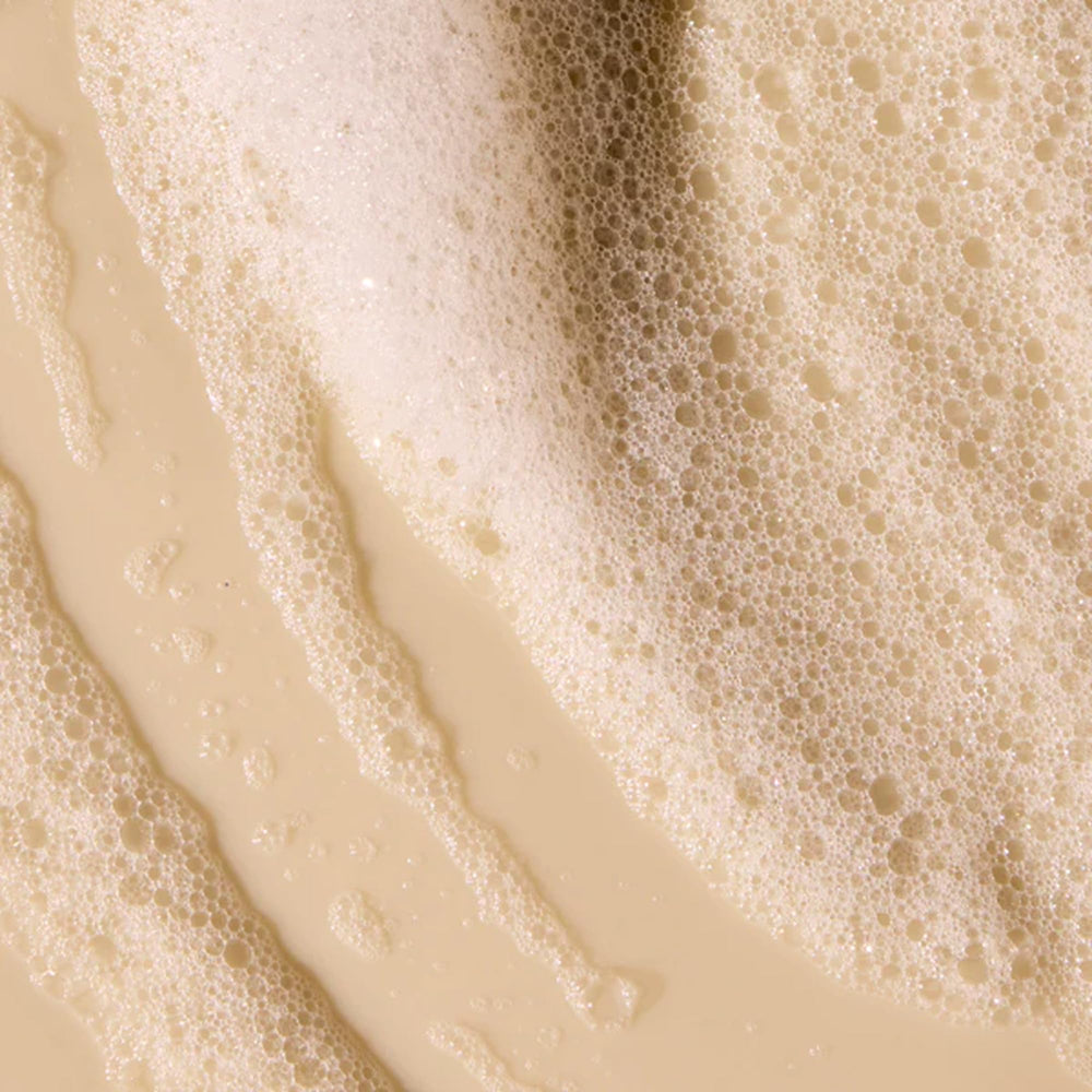 Acure Simply Smoothing Shampoo marula oil detail highlights shine boost and smoother texture.