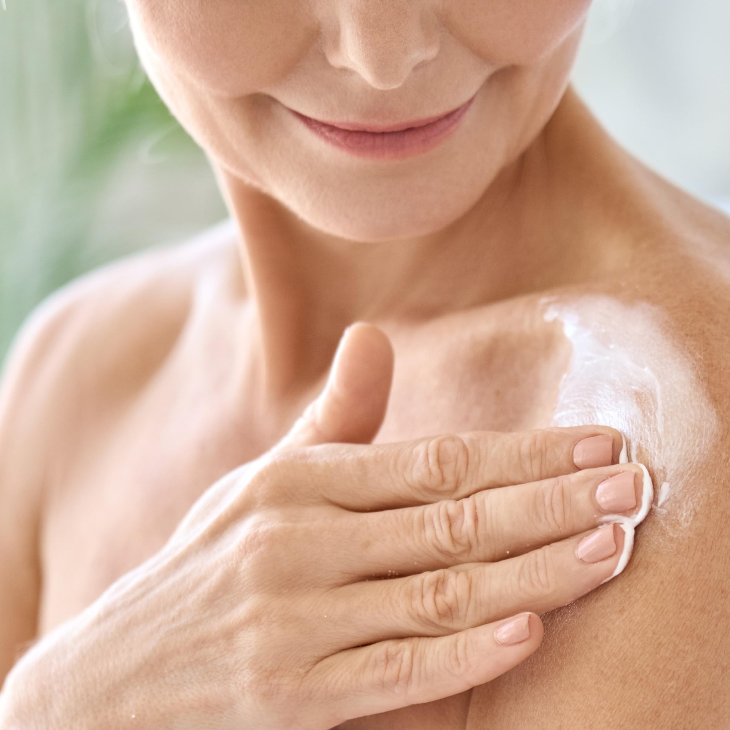 User applying Adamia Therapeutic Repair Lotion for skin relief.