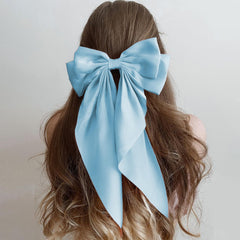 AEGYPIUS blue bow long tails hair clip on styled hair for a polished daily look