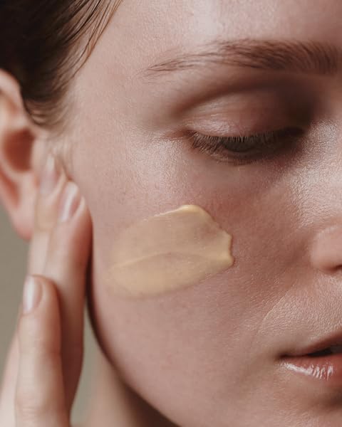 Aesop Camellia Nut Cream texture on skin suggests a hydrated matte finish