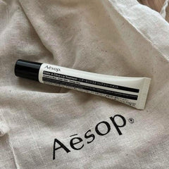 Aesop Cedar & Citrus Lip Balm ingredients visual featuring grapefruit rind, cedar atlas, orange rind for nourishing care