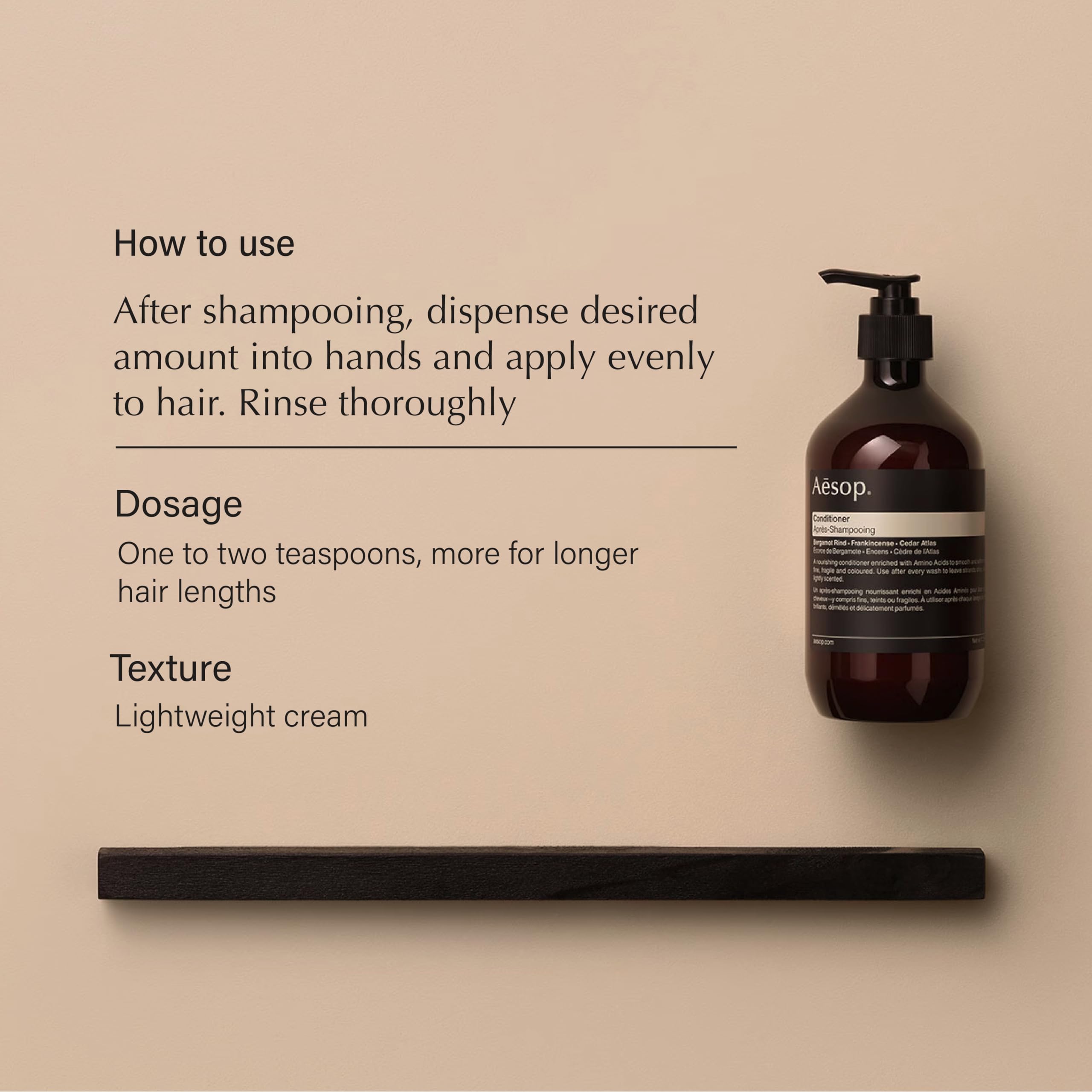 Aesop conditioner being applied to hair for even distribution and hydration.