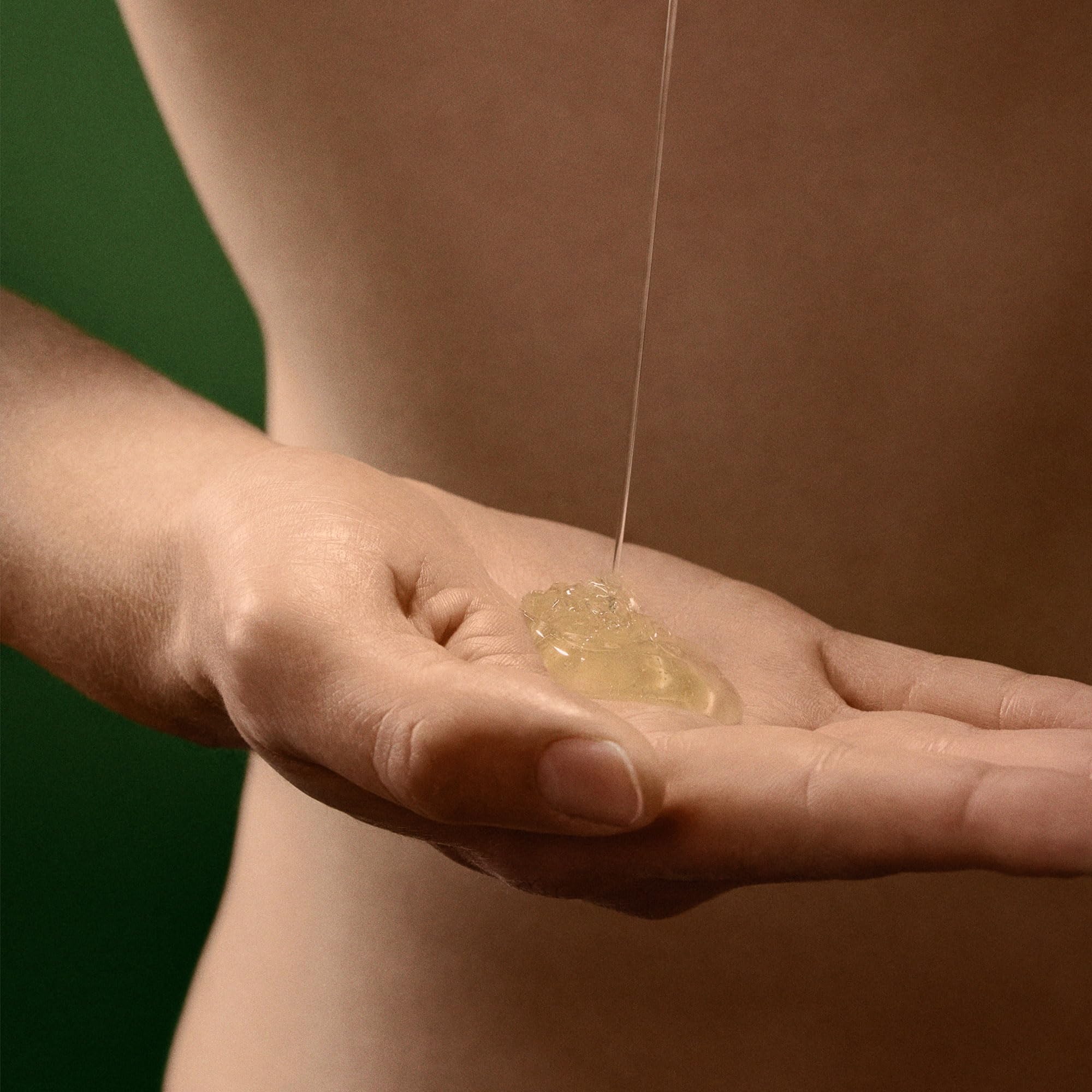 Aesop Geranium Leaf Shampoo rich lather on damp hair.