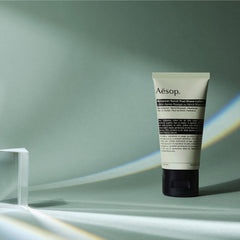 Aesop ingredients close-up shows sandalwood, neroli and panthenol supporting comfort.