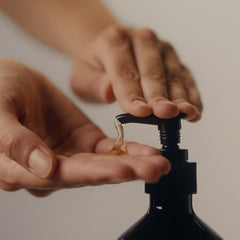 Aesop Resurrection Aromatique Hand Wash lathering close-up demonstrates rich foam for cleansing.