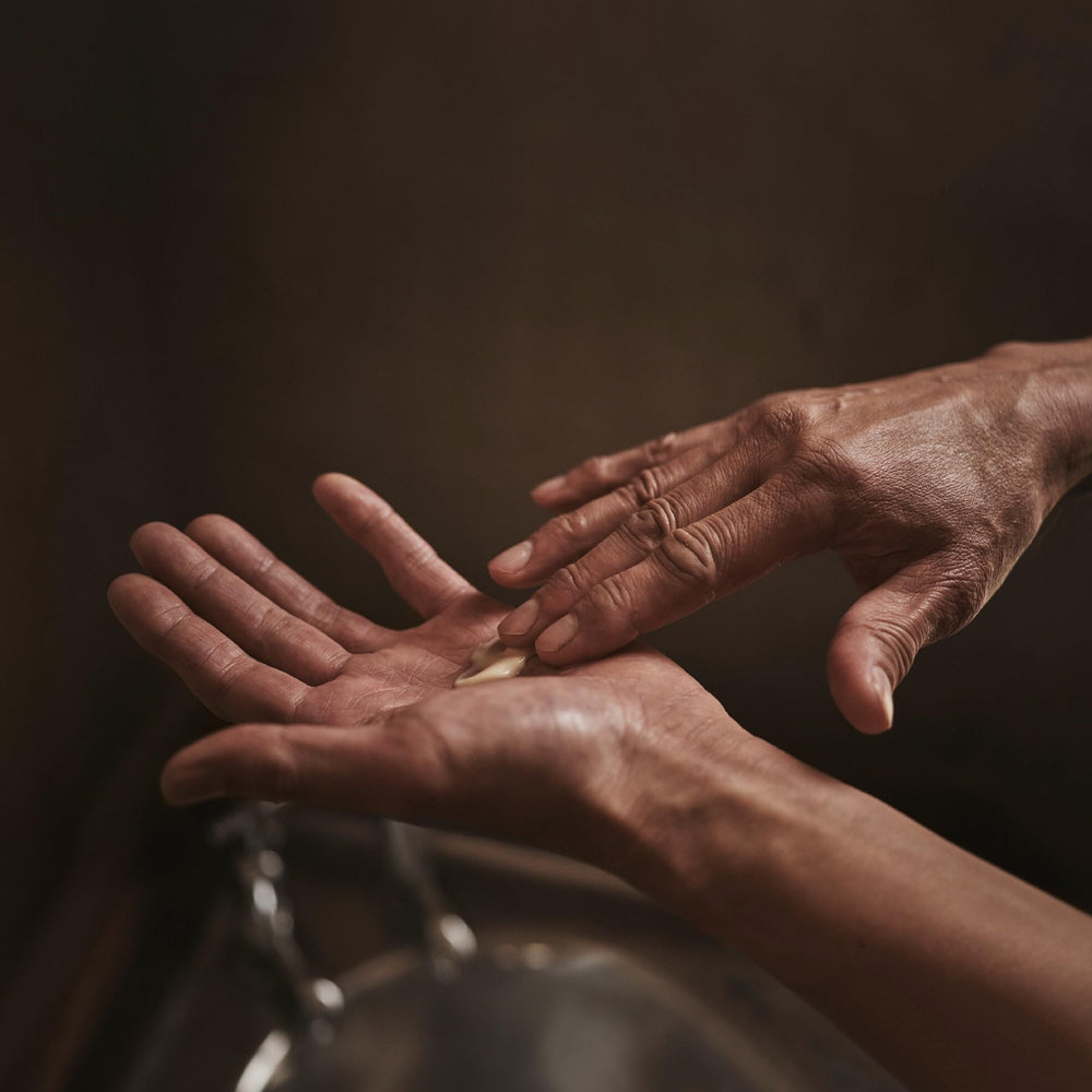 Applied on forearm after sun exposure to illustrate gentle hydration from the balm.