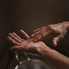 Applied on forearm after sun exposure to illustrate gentle hydration from the balm.