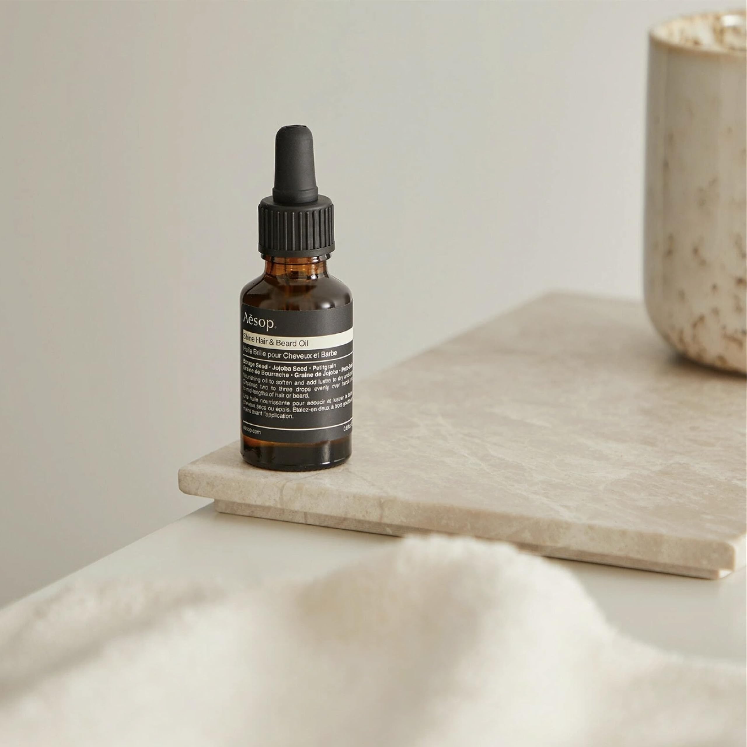 Aesop Shine Oil for coarse, dry hair helps manage texture and reduce frizz.