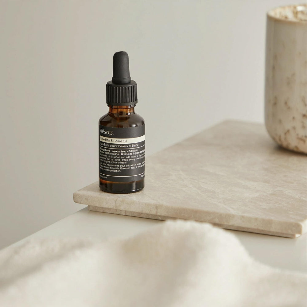Aesop Shine Oil for coarse, dry hair helps manage texture and reduce frizz.