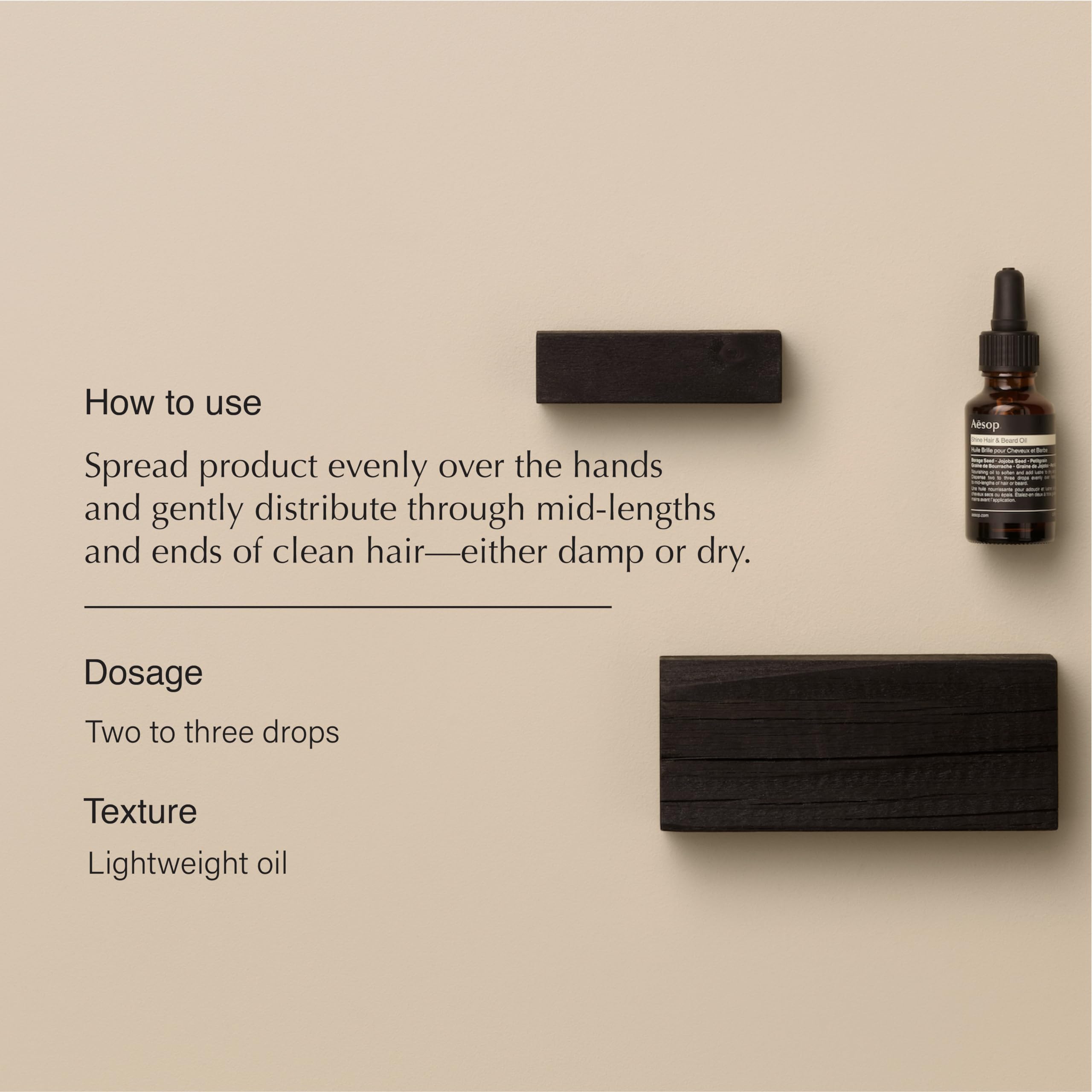 Aesop Shine Oil drops on hand illustrating lightweight nourishment for damp hair.