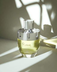 Afnan Rare Carbon heart notes rose and cedarwood suggest polished elegance.