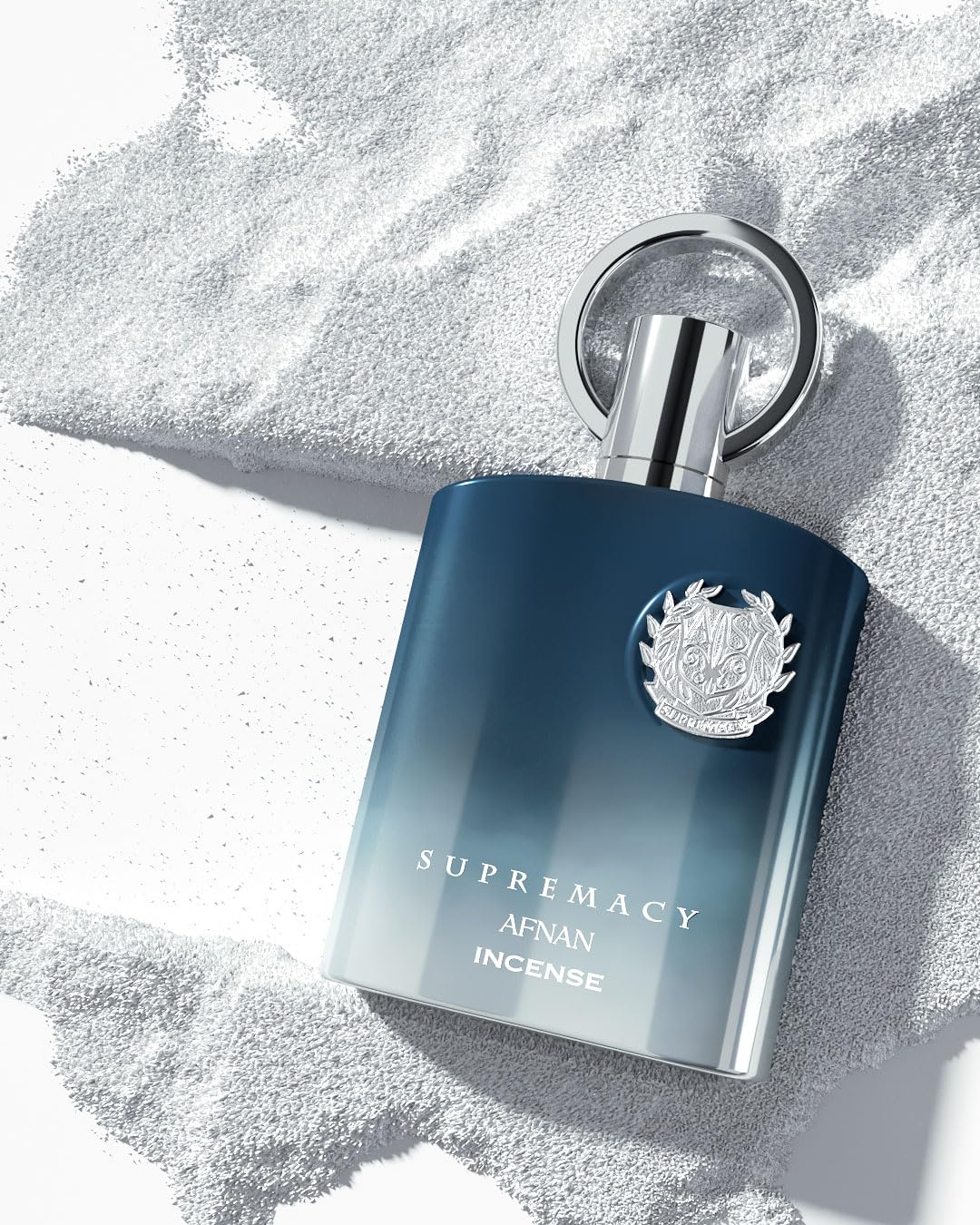 Afnan Supremacy Incense notes on display highlight citrus and spice for a refreshing start.