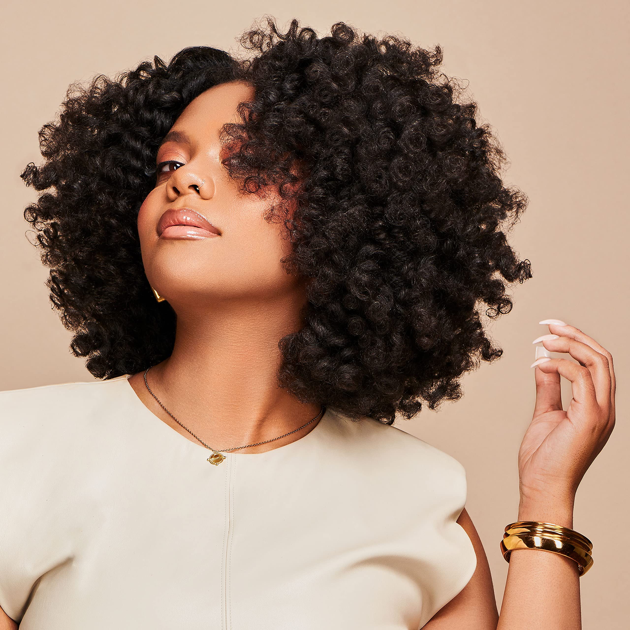 African Pride Moisture Miracle application-hair demonstrates easy daily routine for nourished coils.