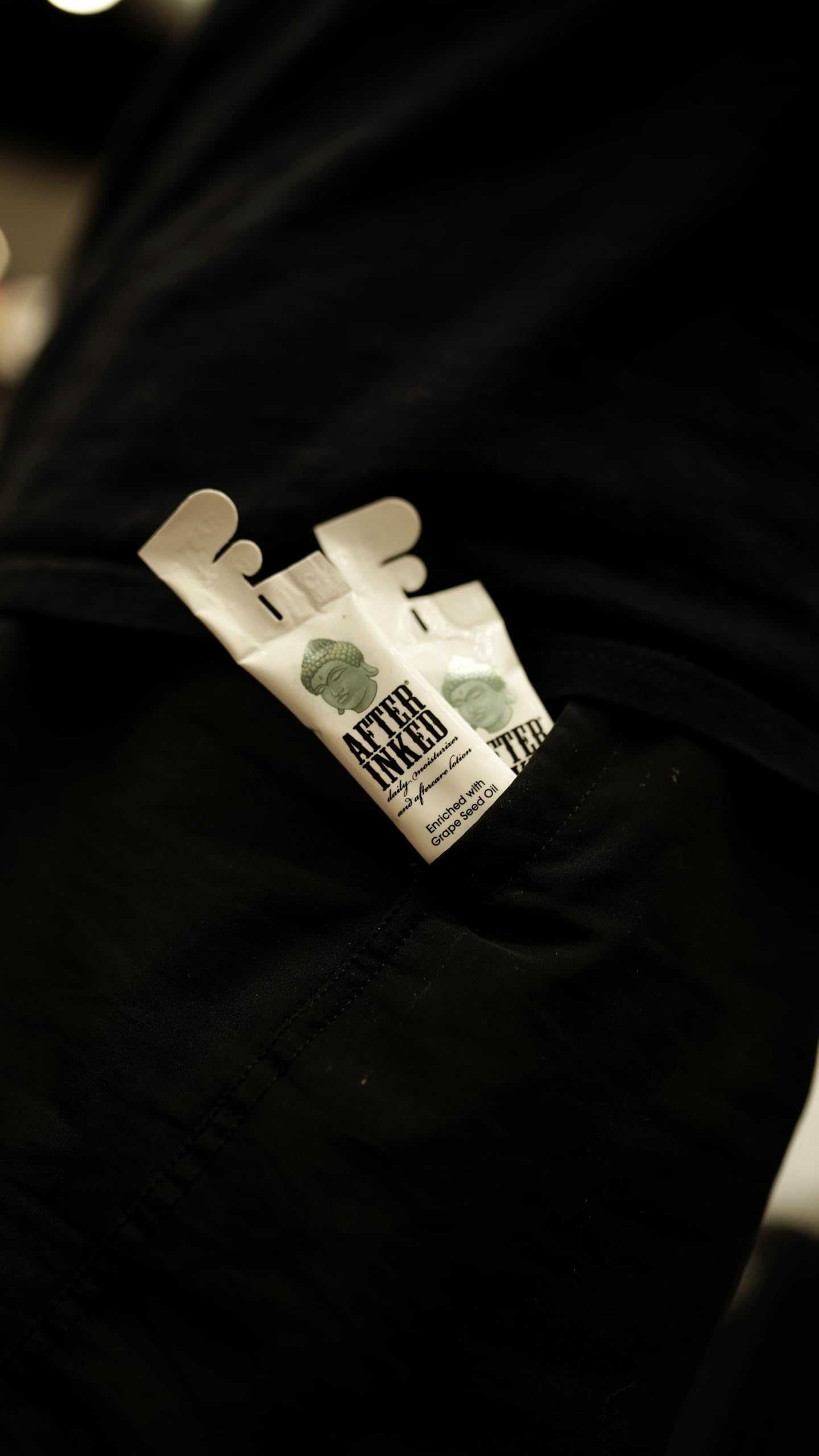 Fifty-pack of After Inked packets in a tattoo studio, keeps artists stocked