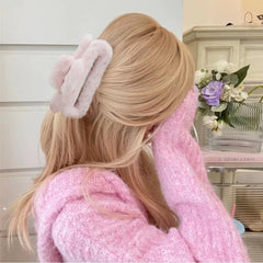 AHONEY fuzzy hair clip pink close-up emphasizes cozy plush and stylish look