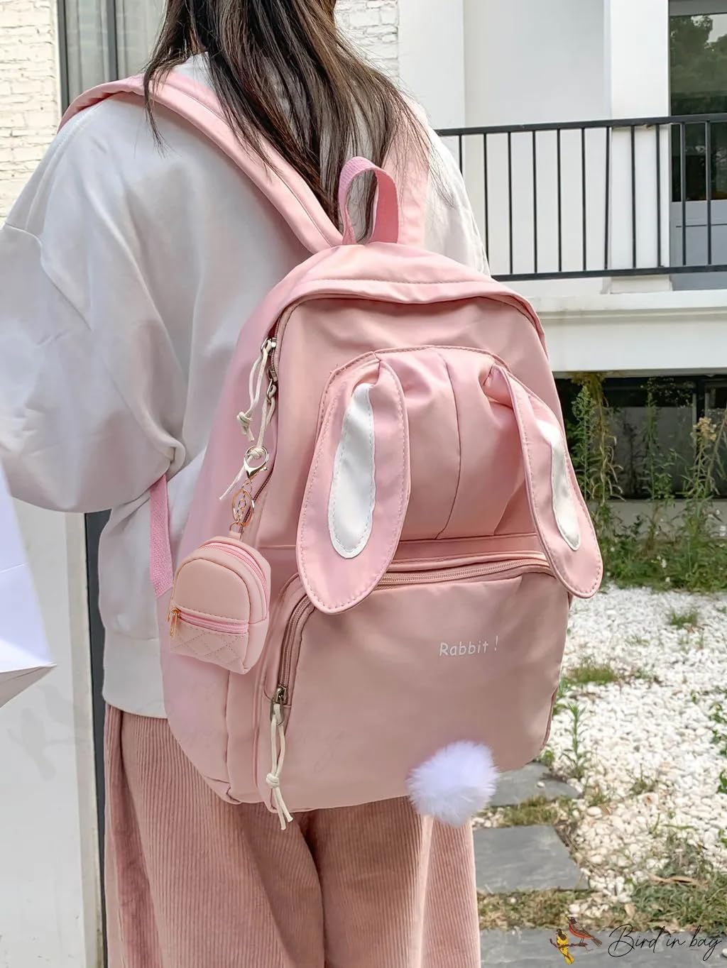 AIBFRID mini backpack keychain in beige offers portable organization for lipstick and cards.