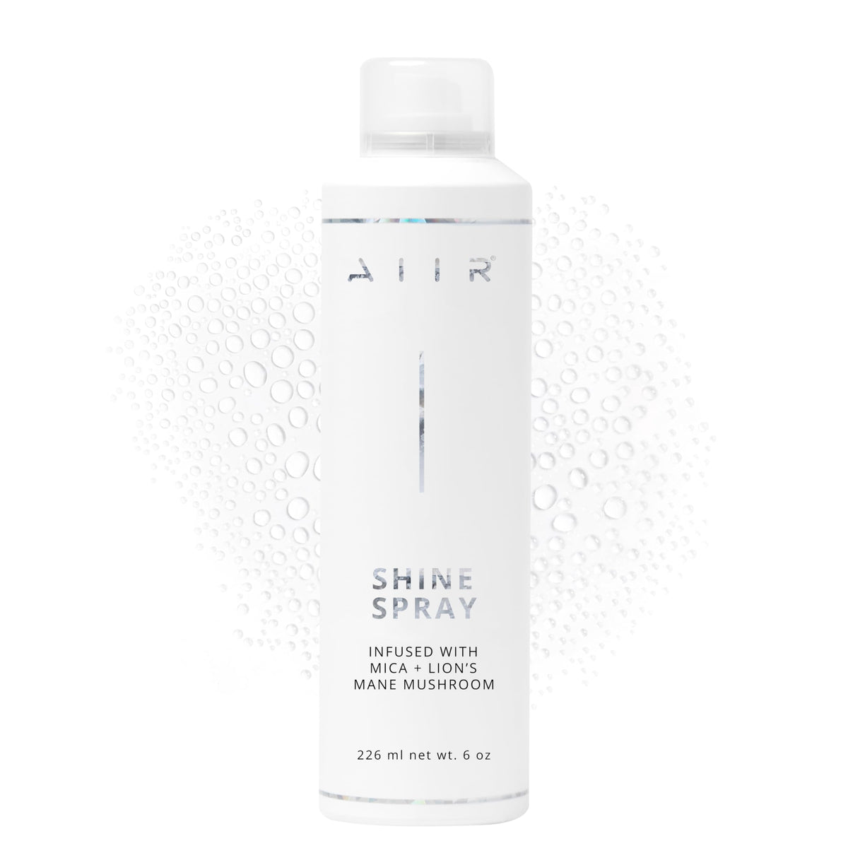 AIIR Shine Spray bottle close-up delivers glossy finish and frizz control.